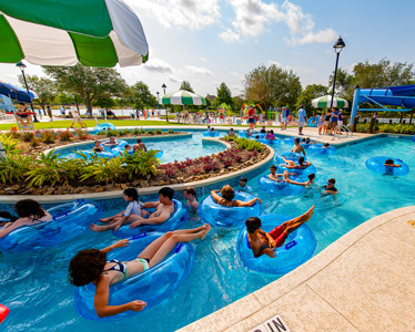 kids and adults lounging around lazy river