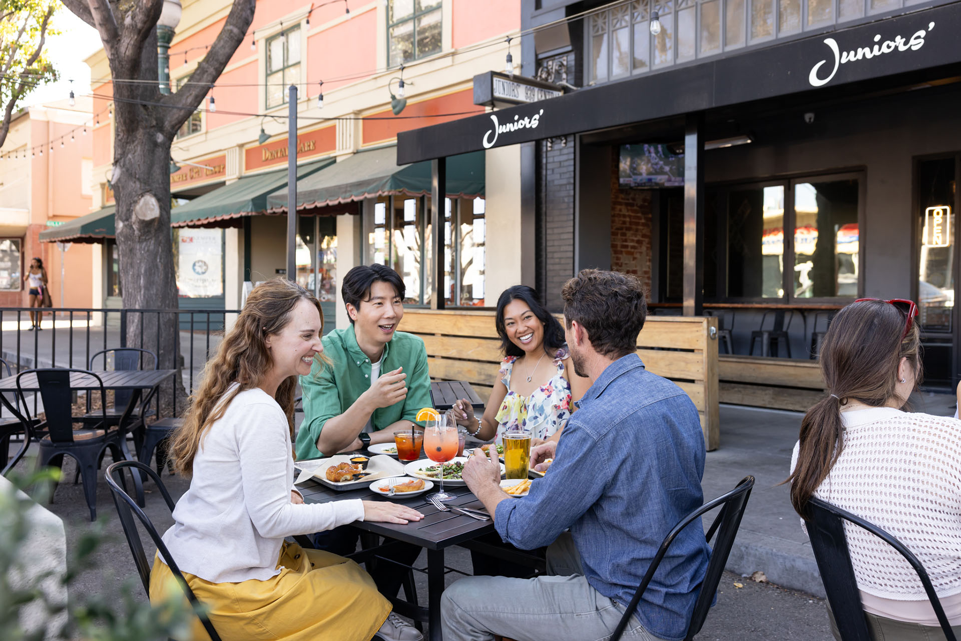 Friends having lunch on a restaurant patio